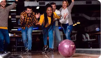 Group of friends enjoying a night out bowling together