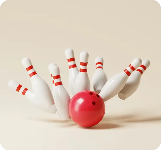 Red bowling ball knocking down white pins for a strike