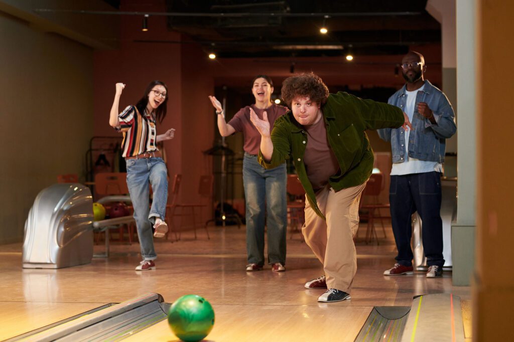 Friends celebrating while bowling at Cactus Bowl Tucson